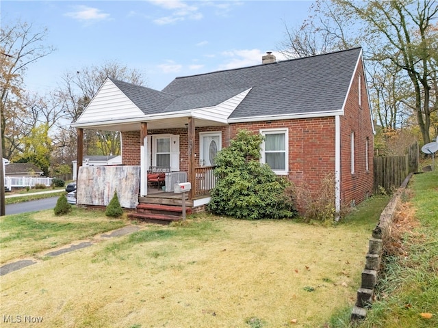 view of front of property with a front yard and a porch