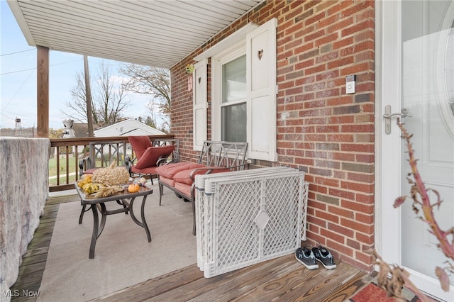 wooden deck featuring a porch