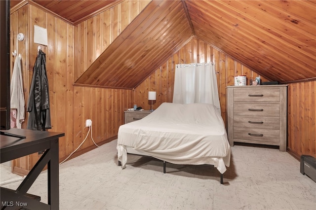 bedroom with wood walls and vaulted ceiling