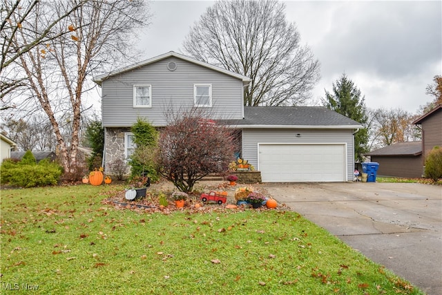 view of front of home with a garage and a front lawn