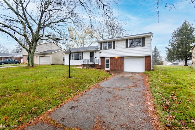 split level home featuring a front yard and a garage