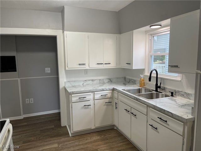 kitchen with white cabinetry, sink, dark wood-type flooring, and stove