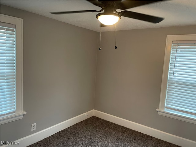 carpeted empty room featuring a textured ceiling and ceiling fan