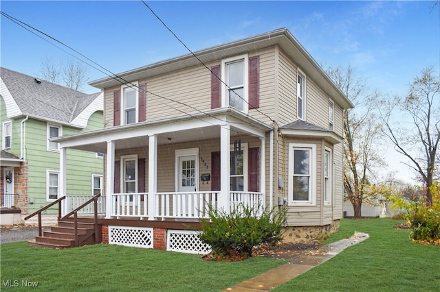 view of front of property with covered porch and a front lawn