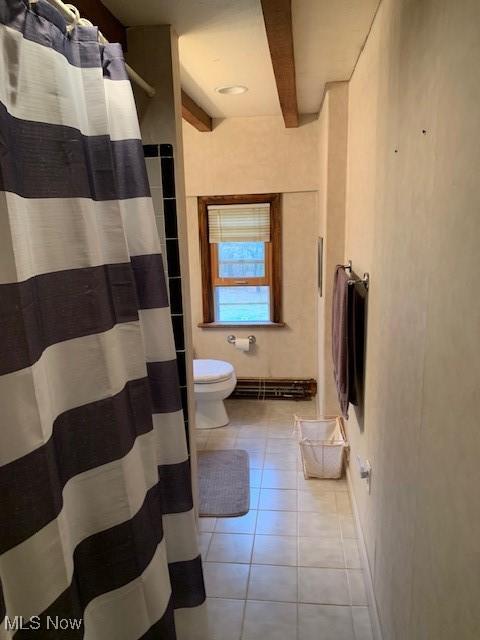 bathroom with toilet, curtained shower, a baseboard heating unit, beam ceiling, and tile patterned floors