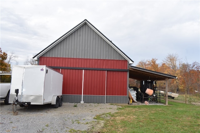 view of outbuilding featuring a yard