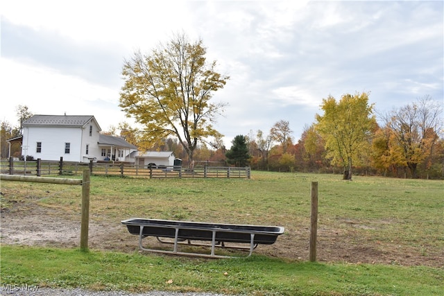 view of yard with a rural view