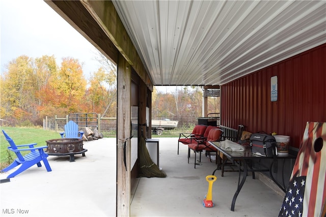 view of patio / terrace with an outdoor fire pit