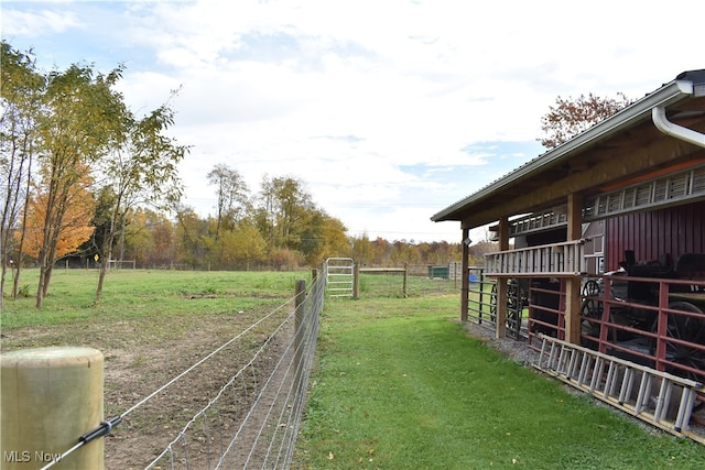 view of yard with a rural view