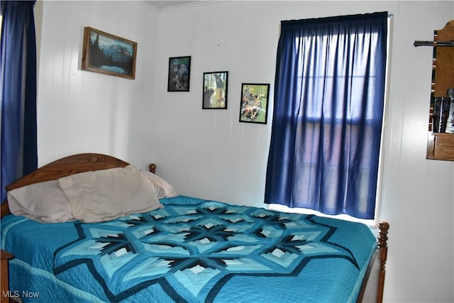 bedroom featuring ornamental molding