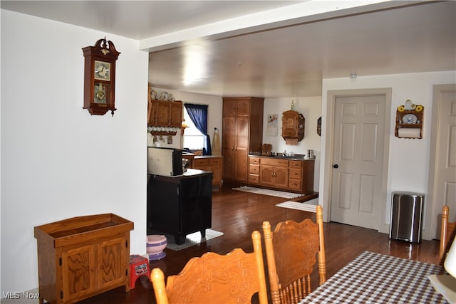 dining room with dark hardwood / wood-style flooring