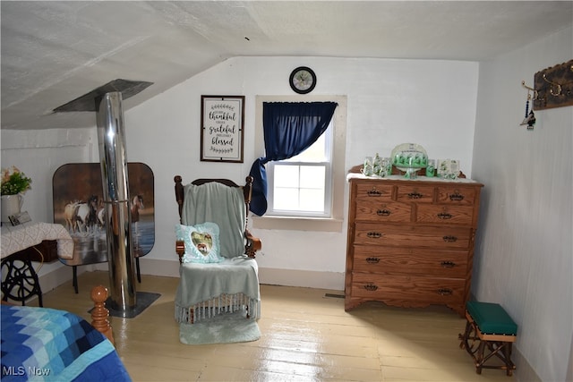 sitting room with light wood-type flooring and lofted ceiling