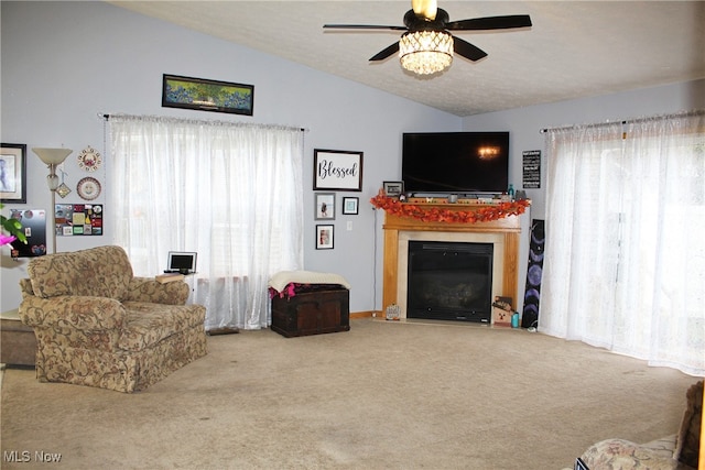 living room featuring carpet flooring, a wealth of natural light, ceiling fan, and lofted ceiling