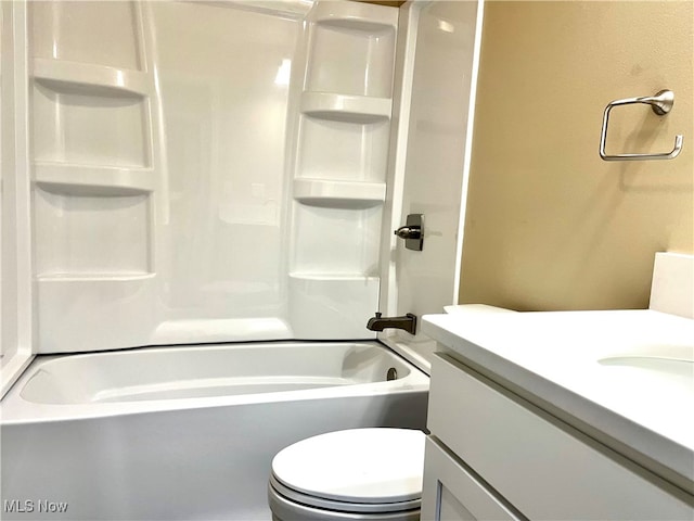 full bathroom with shower / bathing tub combination, vanity, and toilet