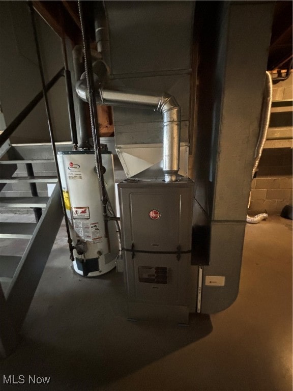 utility room featuring gas water heater