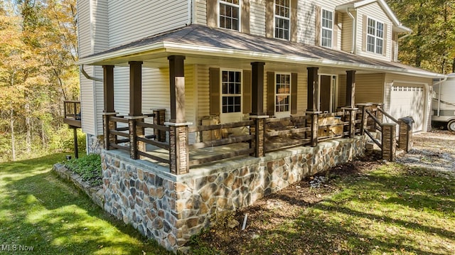 view of front of home featuring a garage and covered porch