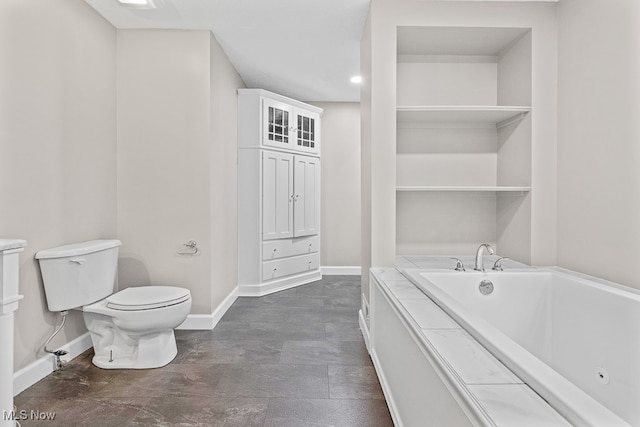 bathroom with a bathing tub and toilet