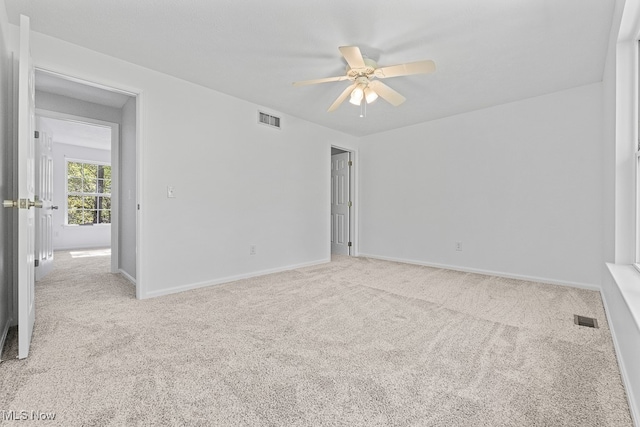 carpeted empty room with ceiling fan