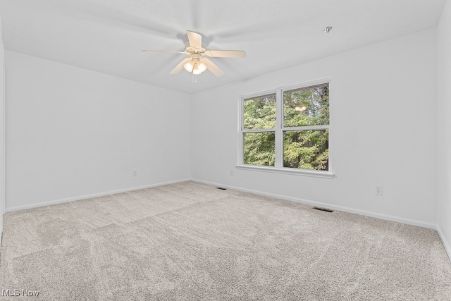 carpeted empty room with ceiling fan