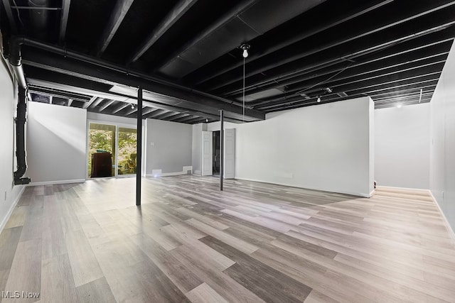 basement featuring hardwood / wood-style flooring