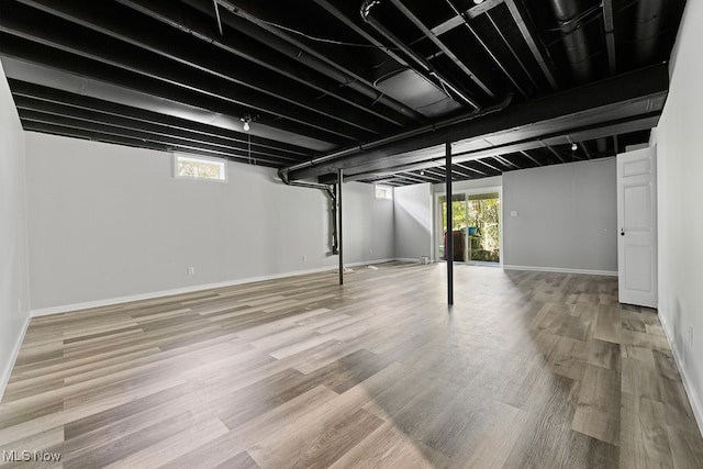 basement featuring hardwood / wood-style flooring