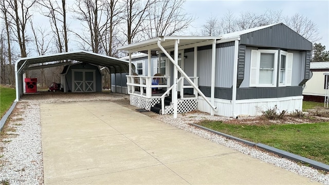 view of front of house with a front yard and a carport