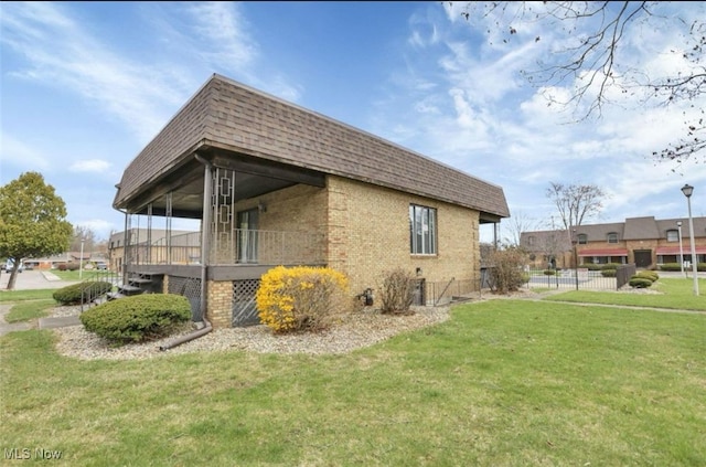 view of property exterior with a yard