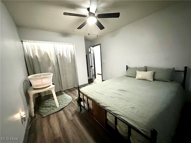 bedroom with hardwood / wood-style floors and ceiling fan