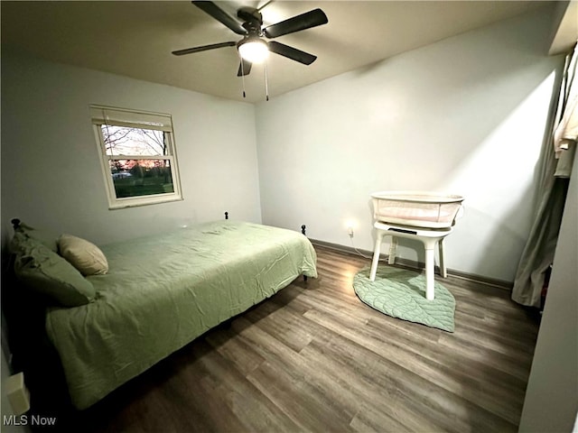 bedroom with hardwood / wood-style flooring and ceiling fan