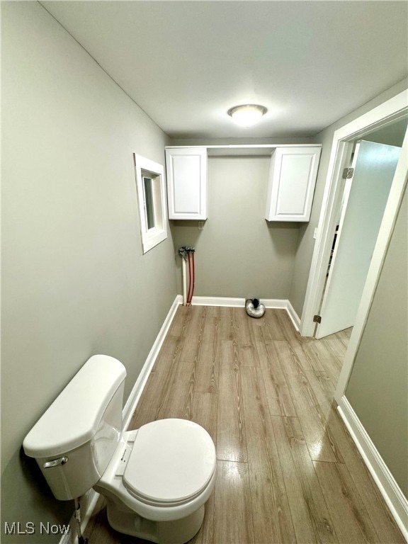 laundry room featuring light hardwood / wood-style floors