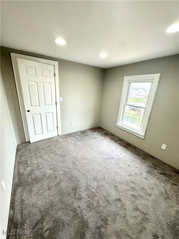 empty room with carpet flooring