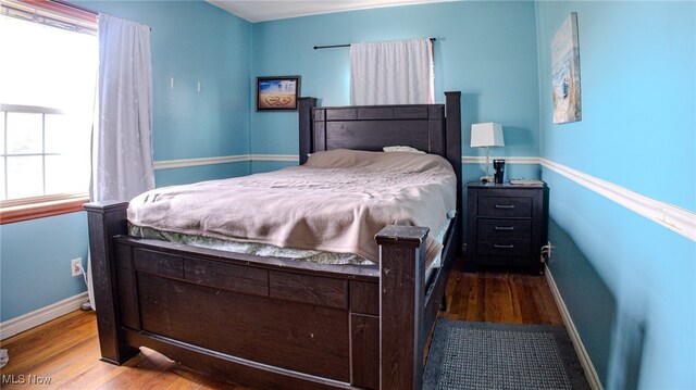 bedroom with light hardwood / wood-style floors