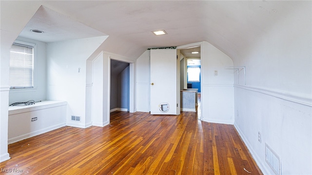 bonus room featuring dark hardwood / wood-style flooring and lofted ceiling