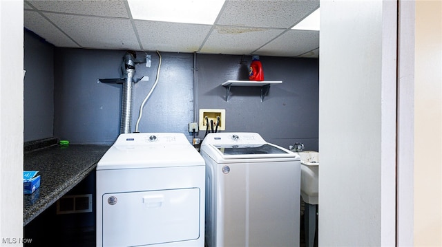 clothes washing area featuring washing machine and clothes dryer