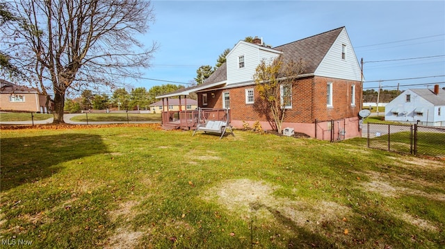 exterior space with a yard and a wooden deck