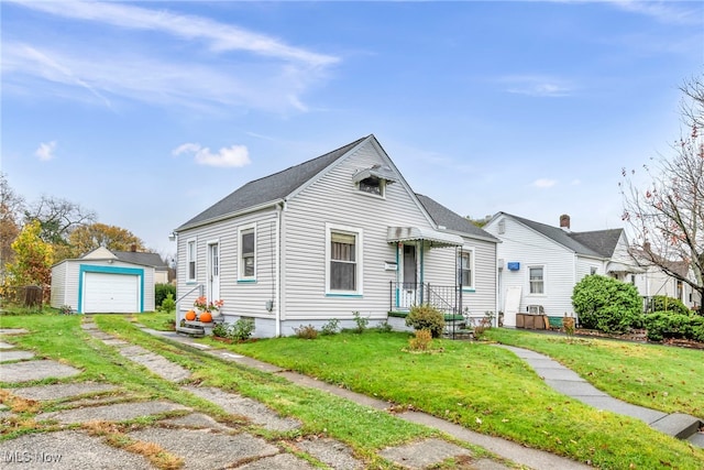 view of front of home with a front lawn, an outdoor structure, and a garage