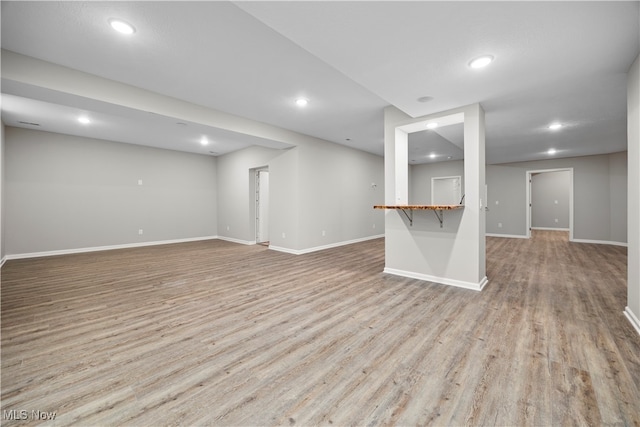 unfurnished living room with light wood-type flooring