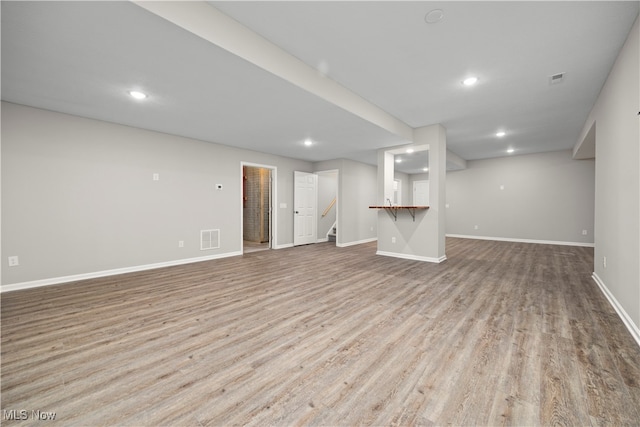 unfurnished living room featuring light wood-type flooring