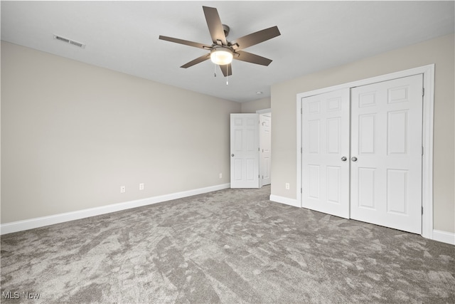 unfurnished bedroom featuring carpet, a closet, and ceiling fan