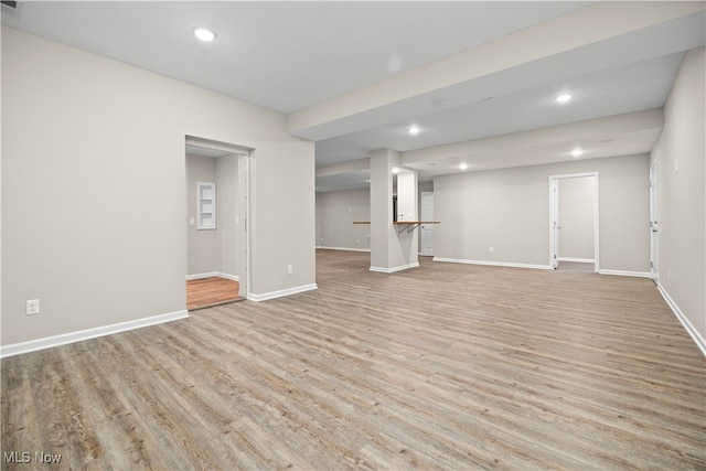 unfurnished living room featuring light wood-type flooring