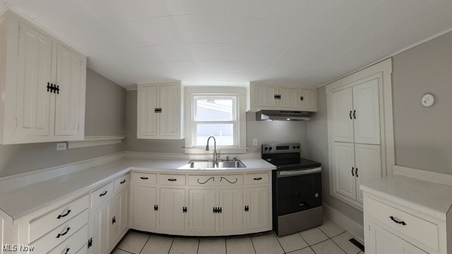 kitchen featuring ventilation hood, sink, electric stove, light tile patterned floors, and white cabinetry