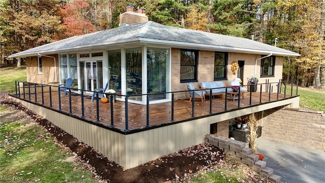 exterior space featuring a sunroom