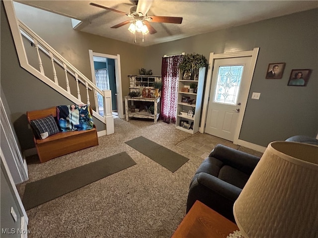 living room with carpet floors and ceiling fan