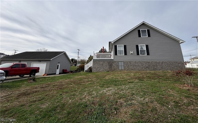 view of home's exterior with a yard and a garage