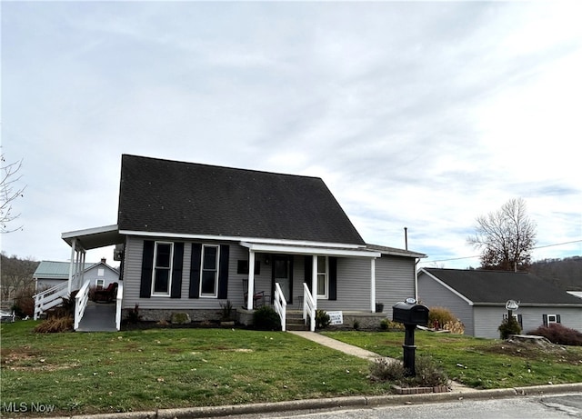 view of front facade featuring a carport, a porch, and a front lawn