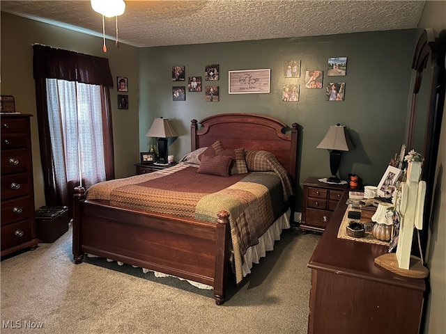 carpeted bedroom with a textured ceiling