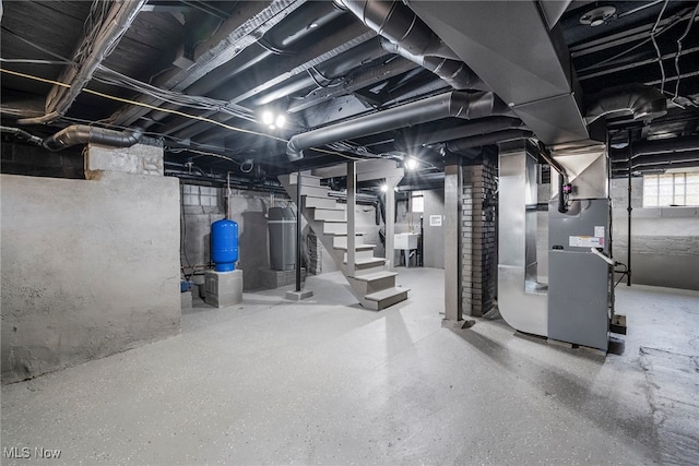 basement with heating unit and sink