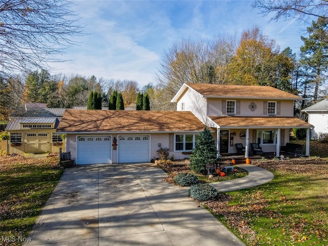 view of front of property featuring covered porch and a garage