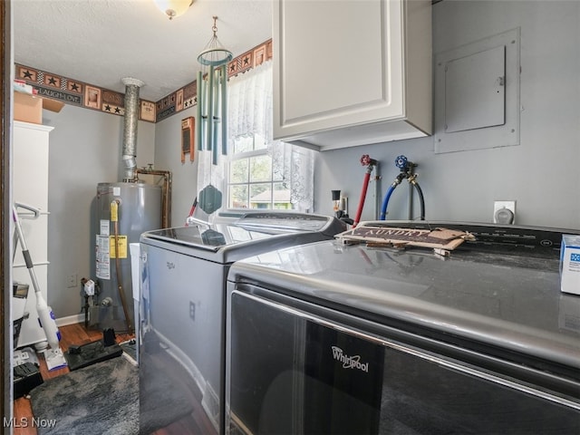 laundry area featuring cabinets, water heater, electric panel, hardwood / wood-style floors, and washer and clothes dryer