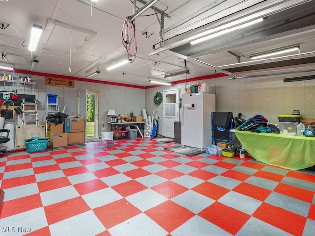 garage with white refrigerator